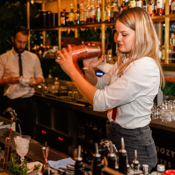Shaking a cocktail behind the bar